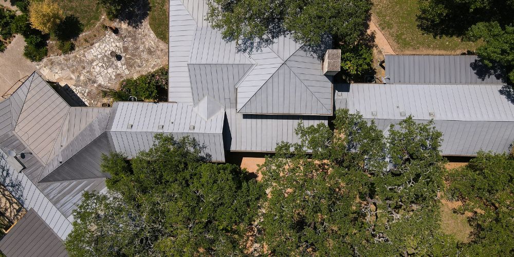 Aerial view of metal roofs on homes, illustrating fire-resistant metal roofing
