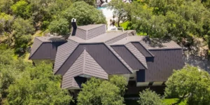 Metal roofing panels with exposed screws and sealing washers